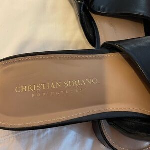 Size 11W black slip-on sandals.